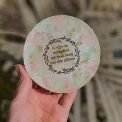 This coaster is very special to me. It features the Gayatri Mantra surrounded by a delicate floral wreath, with a soft pastel background. A piece of peace for your home.