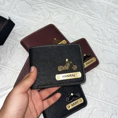 Here's another example of a custom men's wallet, this time in black with a cool motorcycle charm and the name "Maniraj." The textured material gives it a premium feel.