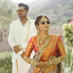 A modern take on royalty, with the couple sporting sunglasses with their traditional South Indian attire. This shot at a palace in Pushkar shows how we can blend tradition with a bit of 'desi' swag.