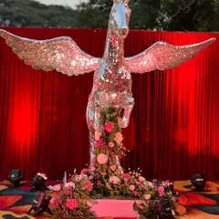 A show-stopping decor piece: a life-sized pegasus statue covered entirely in mirrors, creating a spectacular and glamorous photo opportunity.