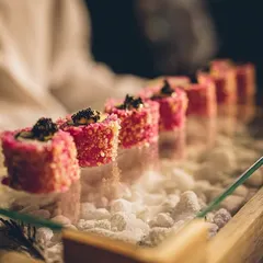Our approach to Pan-Asian cuisine is modern and artful. This is our signature pink sushi, presented on a bed of dry ice for a dramatic effect. We love creating dishes that are as beautiful to look at as they are to eat.
