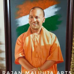 A portrait of Shri Yogi Adityanath ji, the Chief Minister of Uttar Pradesh, painted with the Indian tricolor in the background to reflect his service to the nation.