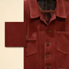 This isn’t just fabric; it’s your narrative woven with intention. A close-up of a rich, red textured jacket, articulating individuality through its unique feel and color.
