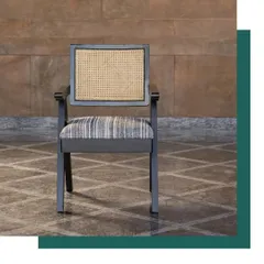 Our contemporary version of the classic Chandigarh Chair. Crafted from sustainably certified oak wood with a cane back, this piece pays homage to Pierre Jeanneret's iconic design while fitting perfectly into modern, elegant interiors.