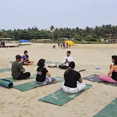 Leading a sunset session on the sand. There is a special energy when we practice together, guided by the ocean breeze. In my group workshops, I help you find your center and connect with a community of like-minded people.