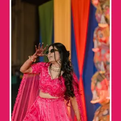 The bride owns the dance floor. This shot captures her vibrant energy and fun-loving spirit during her Sangeet performance, a perfect memory of the night's celebrations.