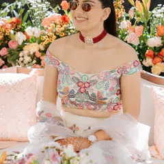 The bride, radiant in the Jaipur sun. The poolside decor for her welcome lunch was filled with pastel florals and traditional elements to create a beautiful, celebratory mood.
