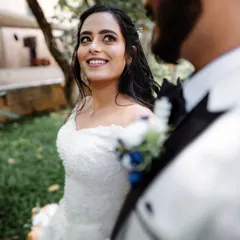 A bride looking radiant in her white wedding gown. We are experienced in capturing the beauty and traditions of Christian weddings.