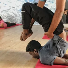 This moment from my teacher training shows a close-up of an assist. Learning the fine details of anatomy and support is crucial for a teacher, and it's this depth of knowledge I use to keep my students safe.