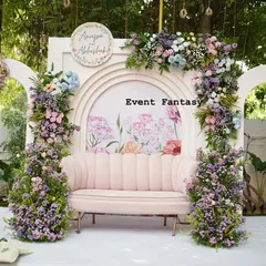 For a modern and romantic engagement, I designed this beautiful pastel floral backdrop. The soft pink couch, surrounded by lush arrangements of roses and hydrangeas against custom arches, created the perfect dreamy atmosphere for Anupa and Abhishek.