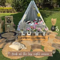 A beautiful boho picnic setup with a "LOVE" centerpiece, perfect for Valentine's Day, an anniversary, or a surprise proposal. The mix of textures and natural elements creates a warm and inviting feel.
