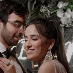 A beautiful, candid close-up of a couple sharing a happy, intimate moment at their engagement. The soft focus and genuine smiles make this a heartwarming portrait.