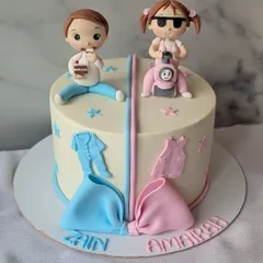 It's been raining twins cakes recently! This one was for a first birthday, with one side for a boy who loves to eat and the other for a "rowdy" girl who loves her scooter.