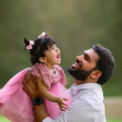 Capturing the sheer joy in a father and daughter's interaction. My goal is to photograph these energetic, happy moments that show the true spirit of your family, using natural light to highlight their expressions.