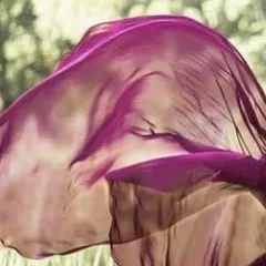 This image captures the essence of our flying gowns. The lightweight purple fabric billows gracefully, showing the kind of movement and drama you can achieve for a truly spectacular pre-wedding photo.