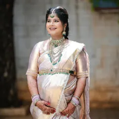 A glowing mom-to-be at her baby shower, looking absolutely radiant in our Victorian-style layered necklace. It's a beautiful choice that adds a touch of modern elegance to the traditional ceremony.