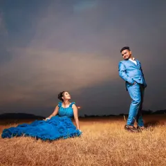 A creative pose from the same photoshoot. The groom's coordinated suit ensures that he looks just as stylish and prominent as the bride in every frame.