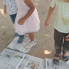 The satisfying crunch of crushing eggshells under our feet. This sensory activity is the first step in preparing natural calcium to enrich the soil for our gardening projects.