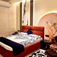 I love creating luxurious master bedrooms that feel like a personal sanctuary. This design combines multiple textures, from the fluted headboard and custom wallpaper to the dramatic marble-patterned wall panels with integrated backlighting, for a truly gorgeous result.