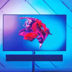 Extend your entertainment experience with ambient lighting that syncs with your TV. This setup uses RGB backlighting to create a halo of color that matches the on-screen action, making movies and games more immersive.