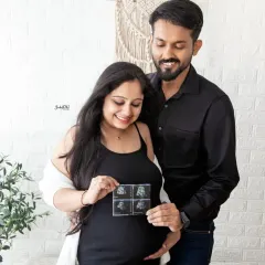 You, me, and the ultrasound pictures make three. This is such a sweet way to announce your pregnancy, and I love capturing the excitement in these early moments.