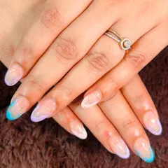 A playful take on the French manicure with soft pastel tips in lavender and baby blue.