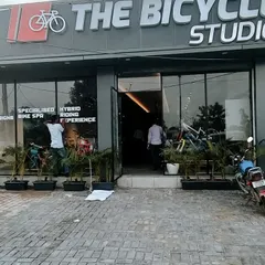 The exterior of 'The Bicycle Studio', a retail project I designed. The facade is modern and clean, with large glass windows to showcase the products within and clear branding that creates an inviting entrance for customers.