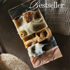 These are my Spring Season Bestsellers, a lineup of my most popular artisan soaps. Each bar has a unique design, from the dark, charcoal-infused bar at the top to the delicate pink marbled bar at the bottom.