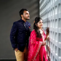 A candid moment between this lovely couple, perfectly coordinated in their rental outfits.