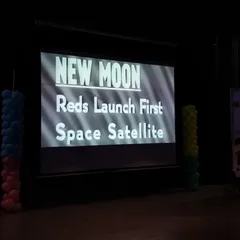 A presentation slide from our National Space Day event highlights key moments in space history, inspiring our students to dream big and reach for the stars.