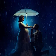 Love shines brightest even in a storm. This creative couple's maternity portrait uses a dramatic rain effect to create a romantic and cinematic moment, showcasing our ability to craft unique, story-driven images.
