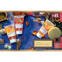 A catalogue page featuring fruit-based face washes from the Love Nature line. The styling uses a rich blue background and dried botanicals to create a vibrant, natural feel for the products.