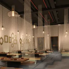 A design for a different kind of lounge, with a more relaxed and artistic feel. This space features low seating, sheer curtains for privacy, and walls adorned with empty golden frames for a quirky, eclectic vibe.