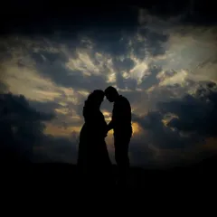 Sometimes the most powerful moments are the quiet ones. I love taking couples outdoors for a natural light session, creating romantic silhouettes like this against the evening sky.