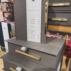 A stack of keepsake boxes and organisers from my Colton Grey House Collection. Made with fabric and featuring metal handles, they are built to last.