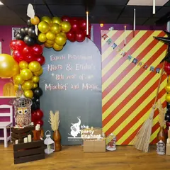 All aboard the Hogwarts Express! This Harry Potter themed photo booth, complete with a Platform 9¾ backdrop and Gryffindor-colored balloon arches, was a huge hit. We focus on iconic details like Hedwig in a cage and a Nimbus broomstick to bring the wizarding world to life.