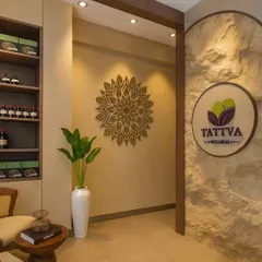 The entrance to a wellness space should set a tranquil tone. Here, we used a combination of rough stone textures and a detailed mandala art piece to signal a transition into a place of calm and restoration.