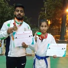 Another one of my champions, a young female athlete from the XMA Noida team, holding her gold medal and certificate from the district championship. We train dedicated athletes, regardless of gender.