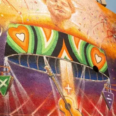 This detailed shot of the Ed Sheeran mural highlights the artist's portrait and the intricate stage design, showcasing the level of artistry involved in our brand collaborations.