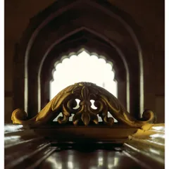 A close-up of the marble latticework inside the tomb, with the arched hallway creating a beautiful frame-within-a-frame.