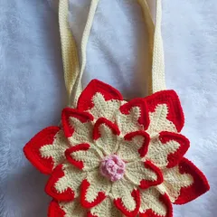 Another view of the Lotus Bag, focusing on the beautiful 3D construction of the flower petals.