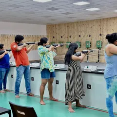 A group of friends lines up for an air rifle session, showcasing a perfect activity for a fun shooting day out. Our spacious lanes allow groups to learn and practice together in a relaxed and friendly environment.