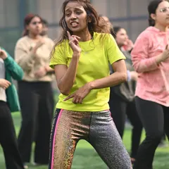 Our choreography services extend beyond weddings to corporate wellness and fitness events. This shot from a high-energy outdoor Zumba session shows how we get large groups moving, making any event fun, engaging, and full of positive vibes.