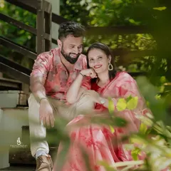 A duplicate of 275, showing a sweet, intimate moment on a wooden staircase, framed by green leaves.