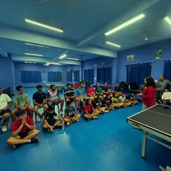 The entire group, including both young and advanced players, participates in a mental fortitude session, fostering a supportive and focused team environment.