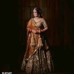 A golden, glowing Sikh bride. This dramatic portrait captures the regal feel of her look, with a heavy focus on bronzed, shimmering makeup.
