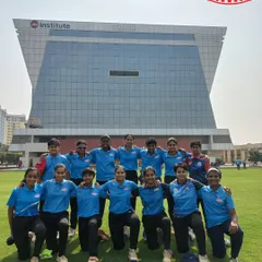 Our girls' team in a huddle before their triumphant league game at the AT Cup Tournament, held at the Jio Institute in Ulwe. We provide a supportive environment for our players to grow as leaders.