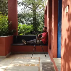 Taking a relaxed moment during a weekend getaway at a farmstay in Kamshet. My camera and telephoto lens are always ready on the tripod, just in case a birding opportunity arises.