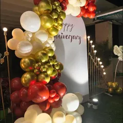 A close-up view of the balloon garland from the anniversary backdrop. This shows the combination of metallic and matte balloons used to create a rich, textured look for the celebration.