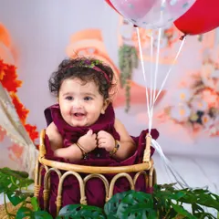 A huge, happy smile from a sweet six-month-old. The half-birthday milestone is a perfect time to capture their budding personality.